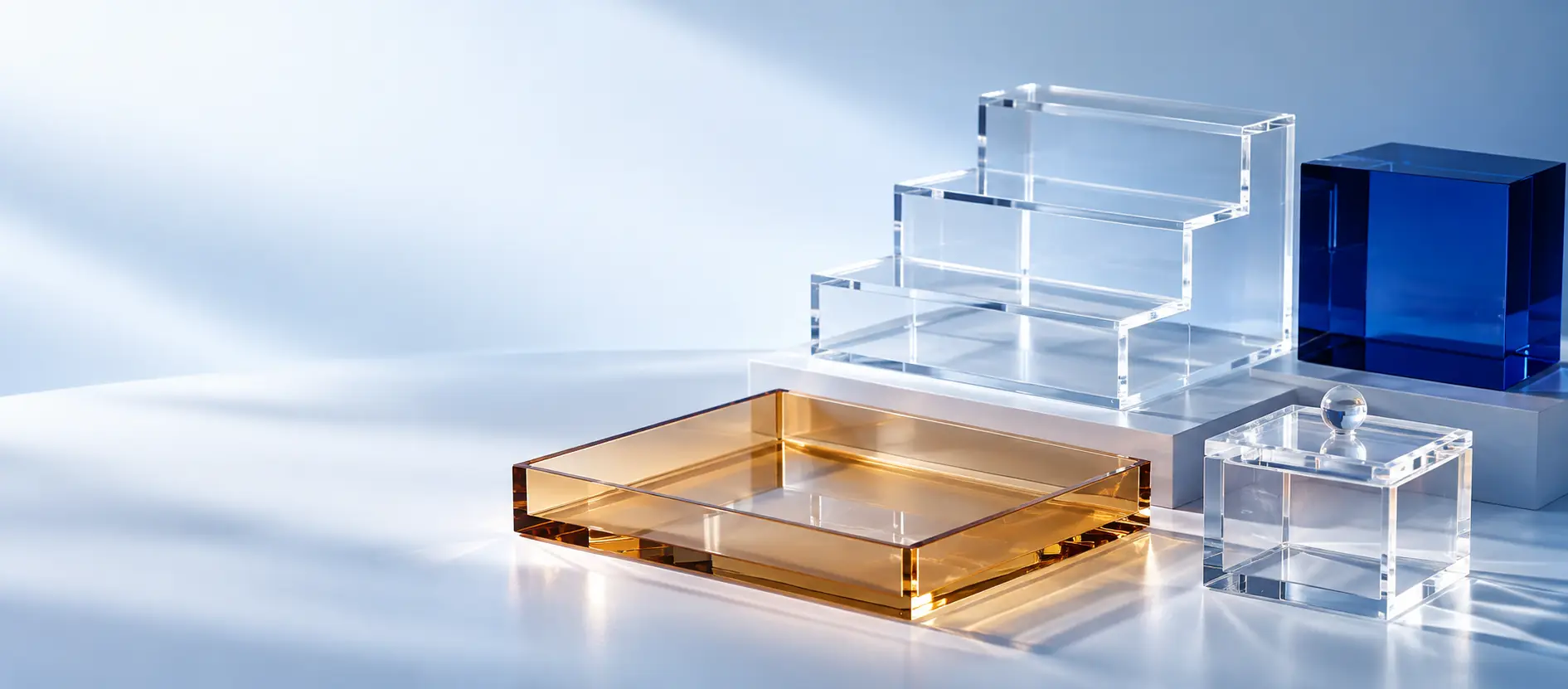 Studio composition showing clear and colored acrylic display, box and tray formats