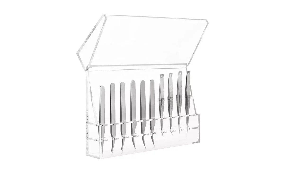 Open clear covered tweezer holder with straight and angled tools positioned above the lower case edge.