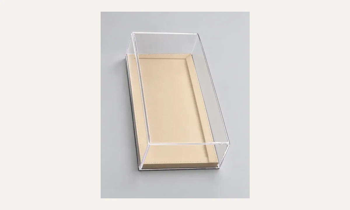 Empty clear rectangular display cover on a separate beige base.