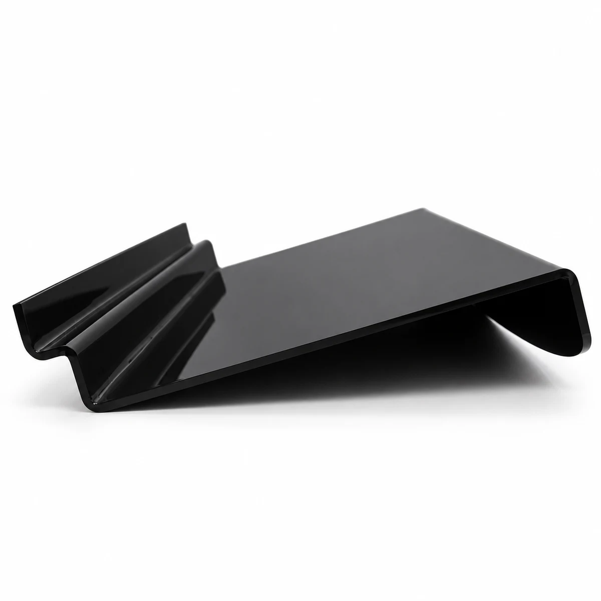 Black bent acrylic display riser with a sloping platform and folded retaining channels
