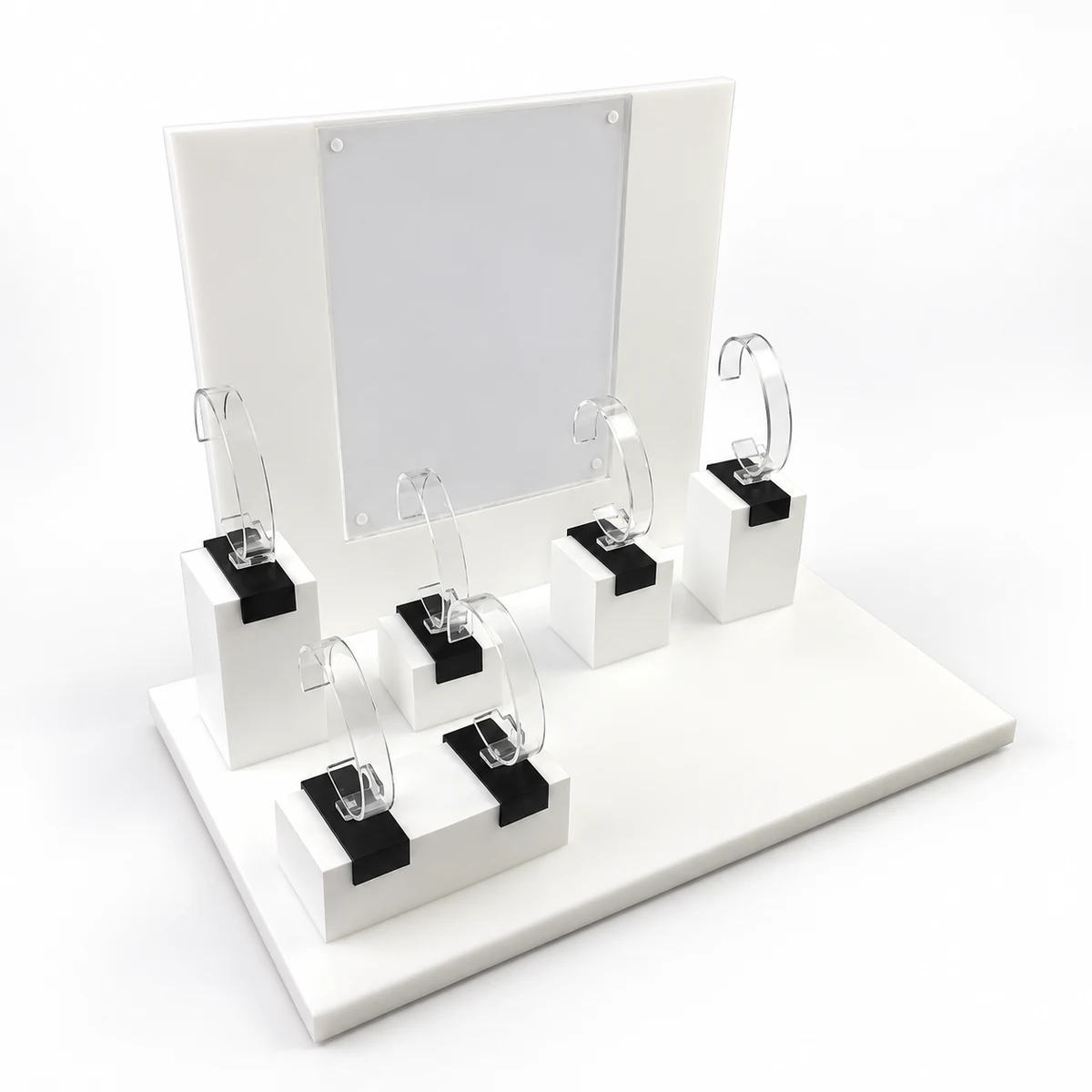 Unbranded white acrylic watch display stand with raised plinths, clear C-shaped holders and an upright rear panel