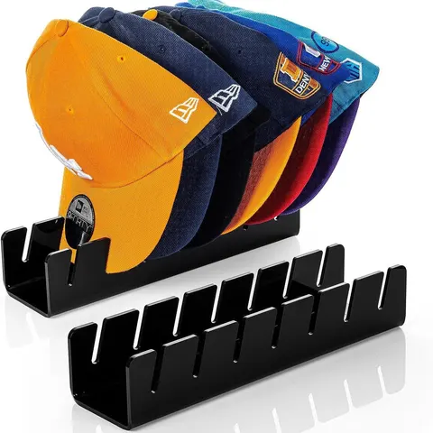 Slotted acrylic cap organizer holding cap brims in a row
