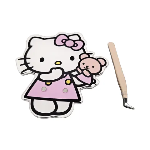 Pink character-shaped lash tile with a bow graphic and magnetic tool positions