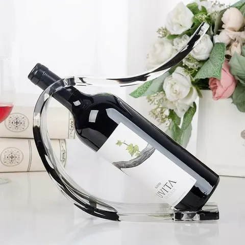 Curved loop-profile acrylic holder displaying a single wine bottle