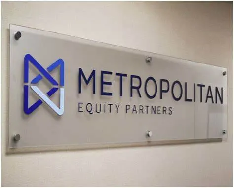Printed acrylic door sign mounted with metal standoff-style fixings