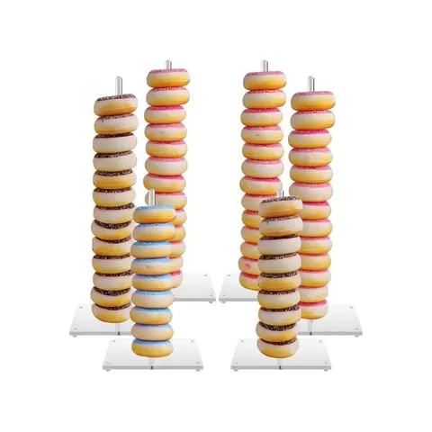 Grouped vertical acrylic rods displaying stacks of ring donuts