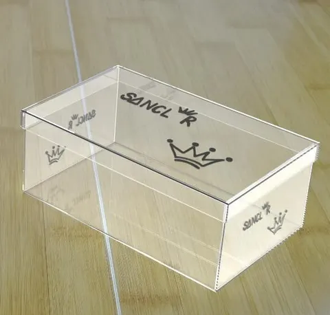 Clear acrylic shoe display box with a hinged opening