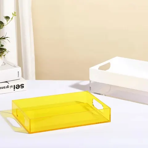 Colored rectangular acrylic serving tray with raised sides and handle openings