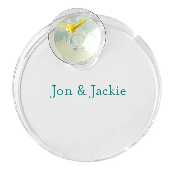 Round clear acrylic serving tray with a raised edge and personalized decoration