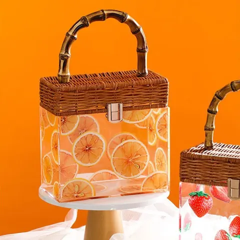 Transparent fruit-pattern gift box with a woven-look lid and loop handle