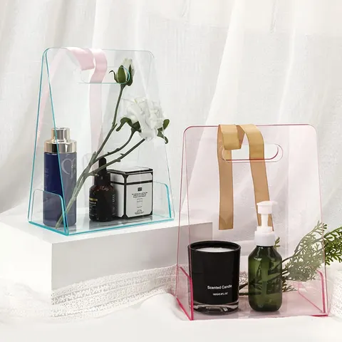 Open transparent gift-bag display with tall panels and cutout handles