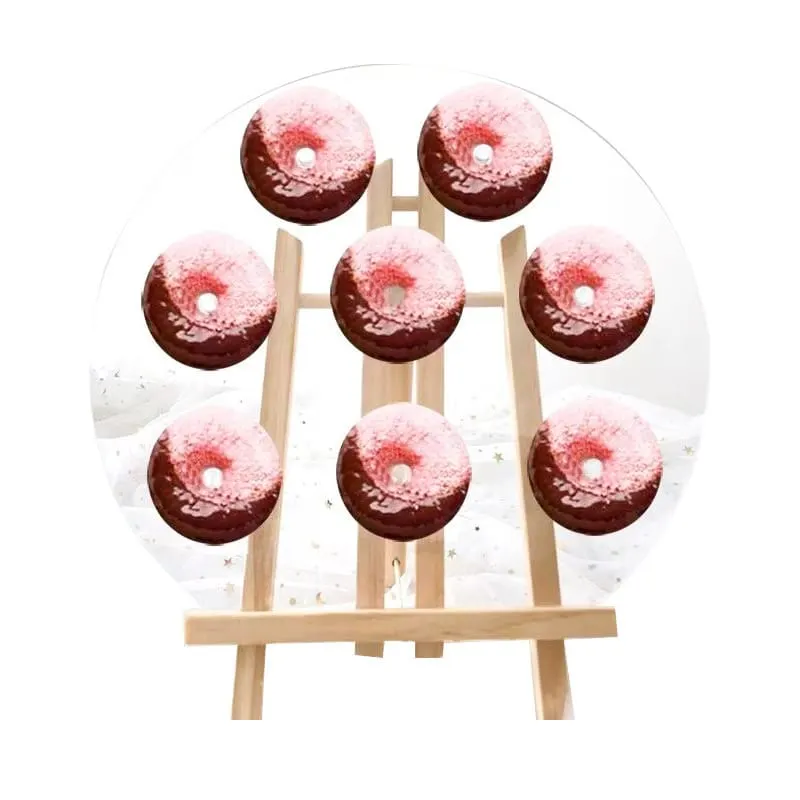 Upright wooden peg board displaying ring donuts in rows