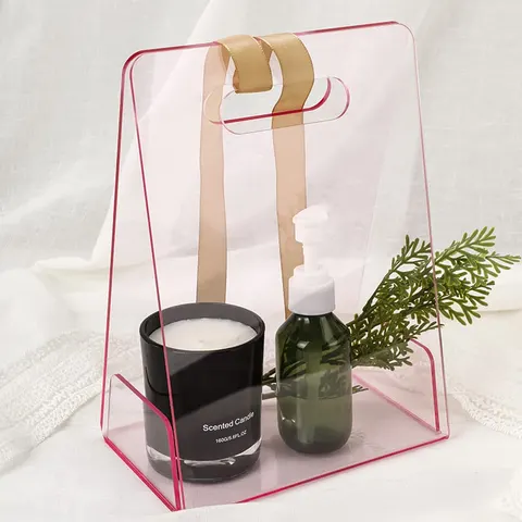 Open transparent gift-bag display with tall panels and cutout handles