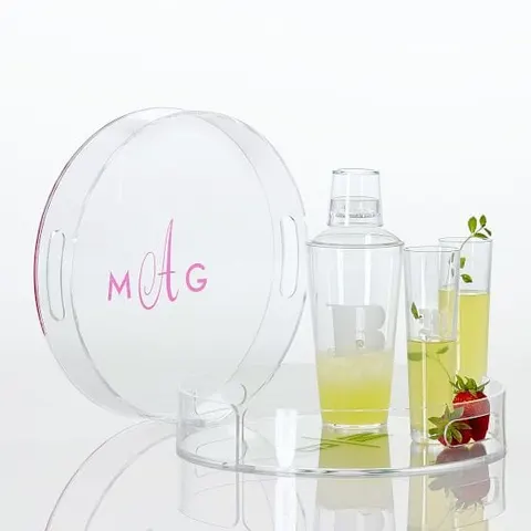 Round clear acrylic serving tray with a raised edge and personalized decoration