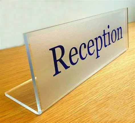 Freestanding bent acrylic table sign with a printed logo