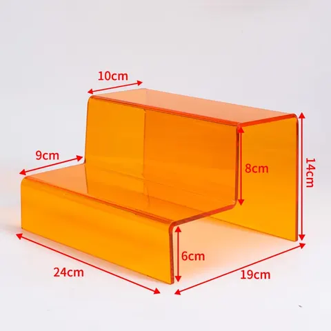 Stepped acrylic display riser with a dimensioned 24 by 19 by 14 cm reference