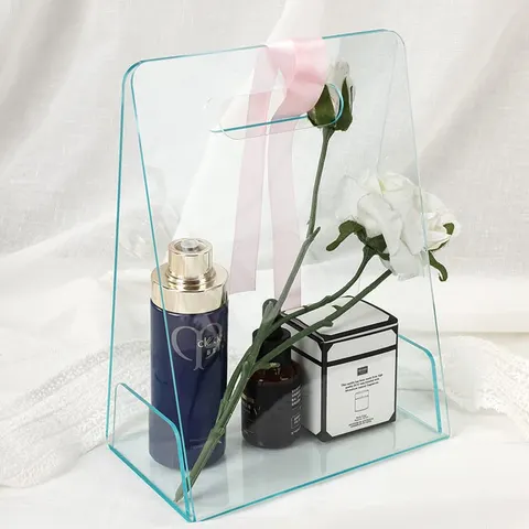 Open transparent gift-bag display with tall panels and cutout handles