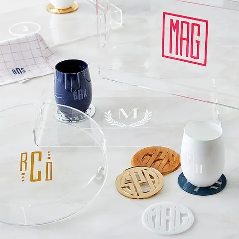 Round clear acrylic serving tray with a raised edge and personalized decoration