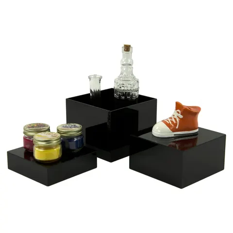 Acrylic cube and plinth formats used to create product display levels