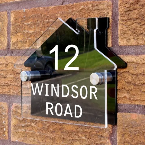 Printed acrylic door sign mounted with metal standoff-style fixings